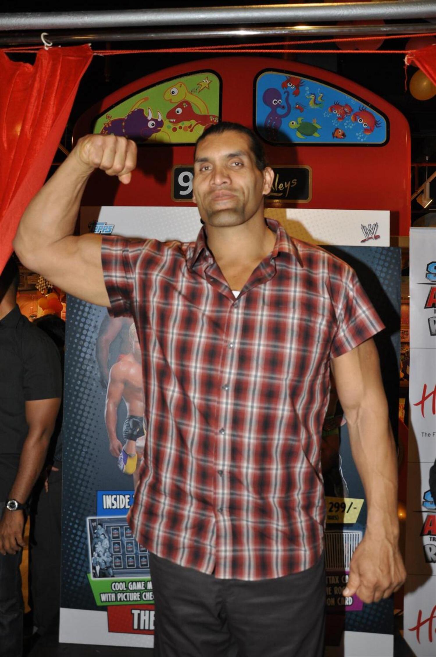 WWE Superstar Khali posing for photographers at the launch of trading ...
